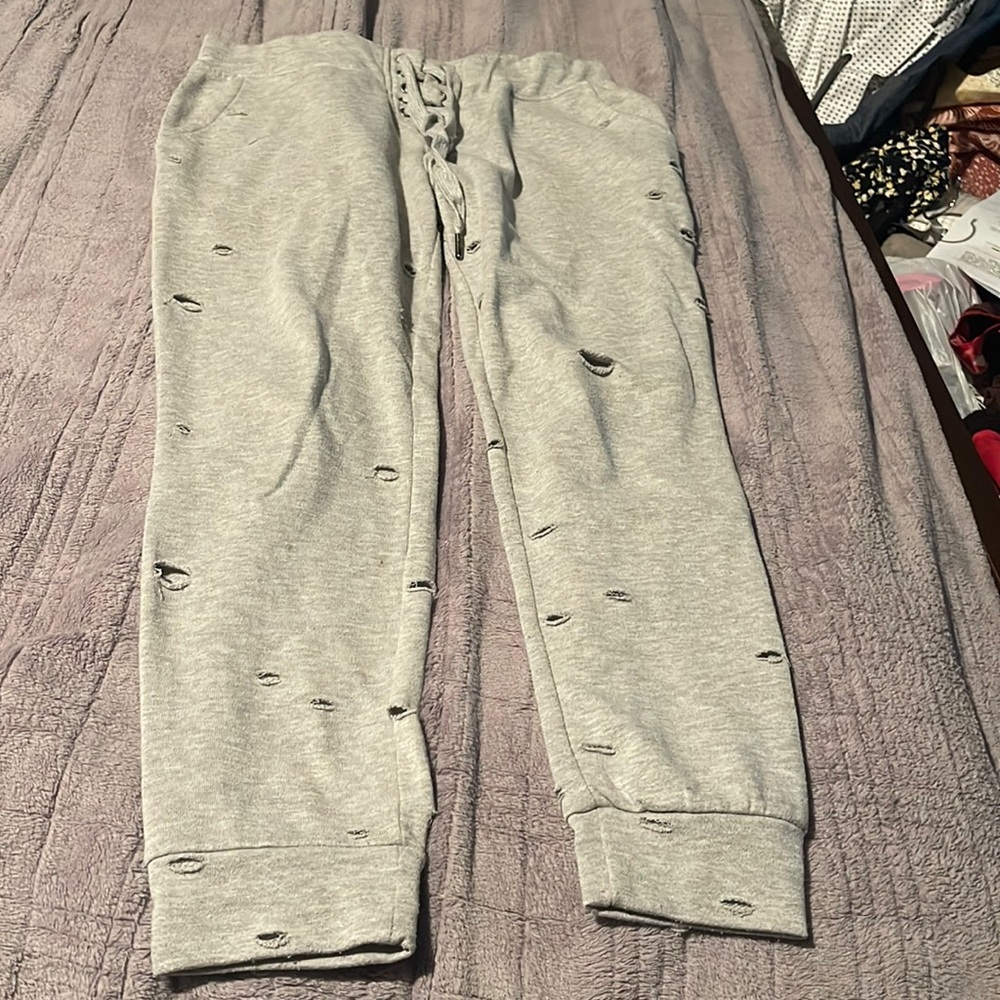 baggy grey sweats with cut outs